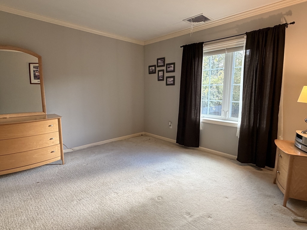 7 Conant Road, Unit 21 Winchester, MA 01890 - Photo 14 of 27 an empty room with windows and closet