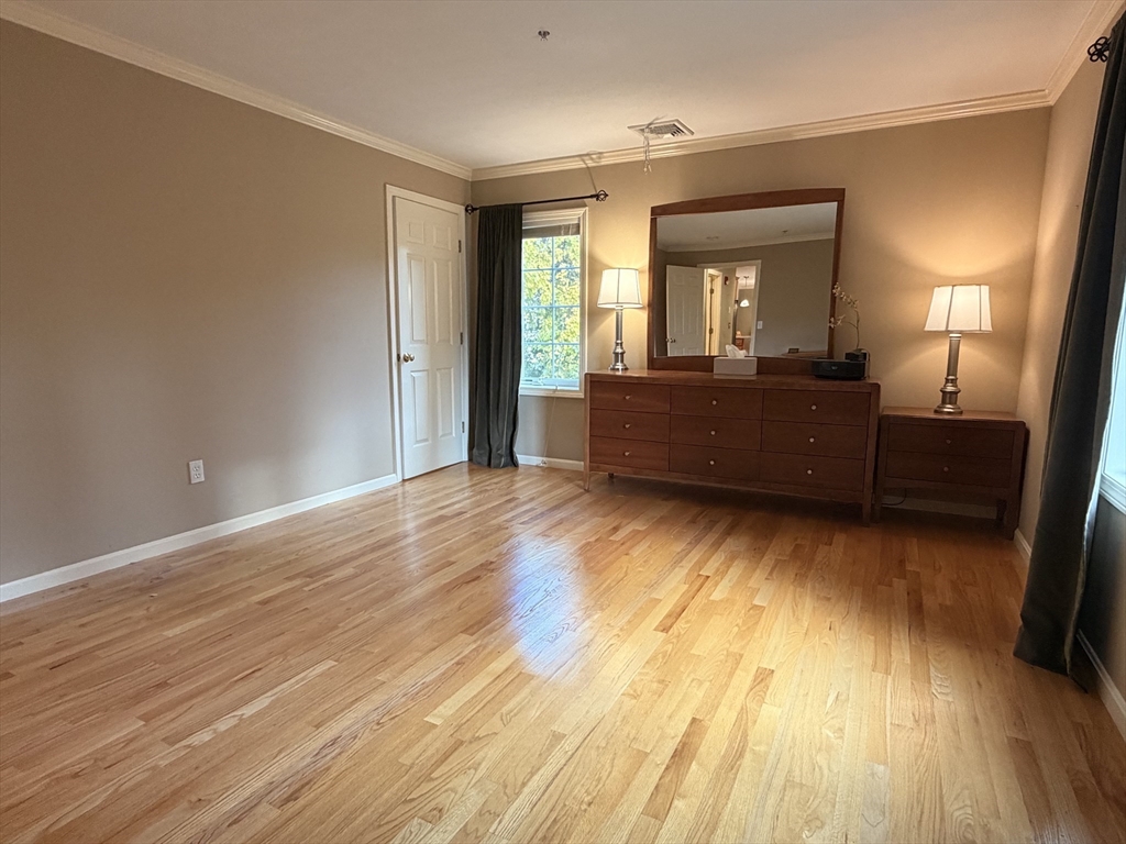 7 Conant Road, Unit 21 Winchester, MA 01890 - Photo 17 of 27 a living room with a wooden floor
