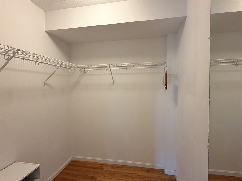 7 Conant Road, Unit 21 Winchester, MA 01890 - Photo 20 of 27 a view of a room with racks on the wall