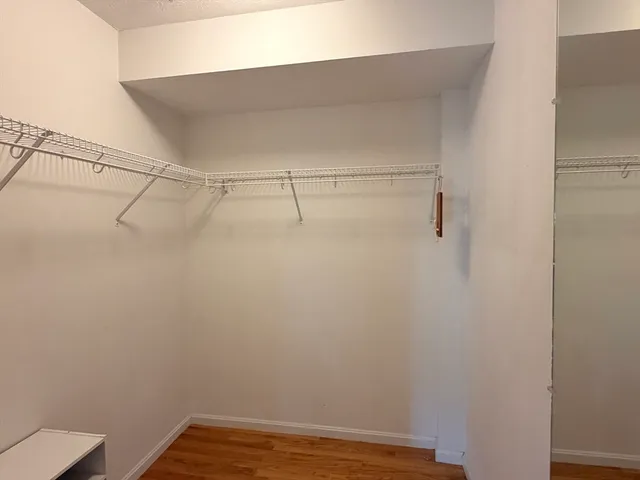 a view of a house with a garage and yard