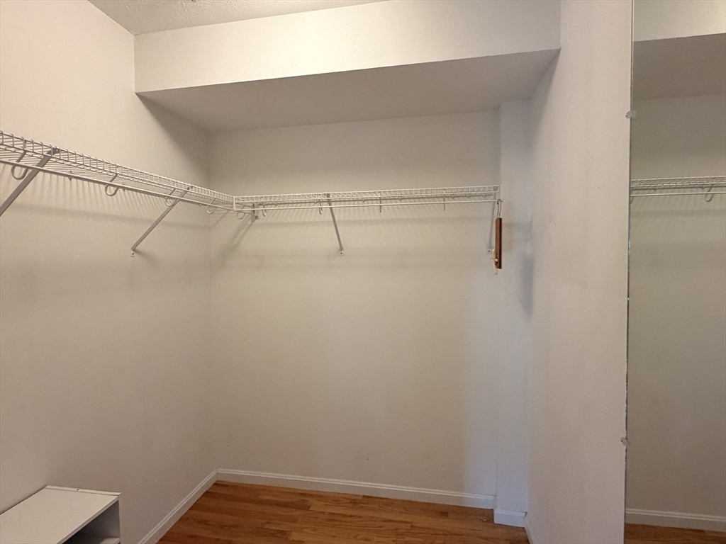 7 Conant Road, Unit 21 Winchester, MA 01890 - Photo 20 of 27 a view of a room with racks on the wall