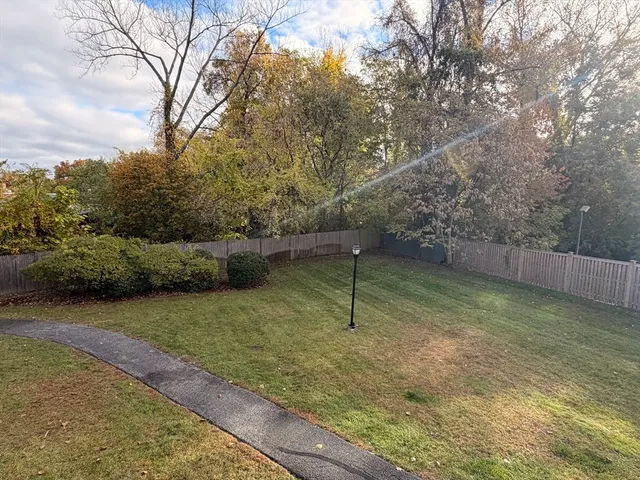 a backyard of a house with lots of green space