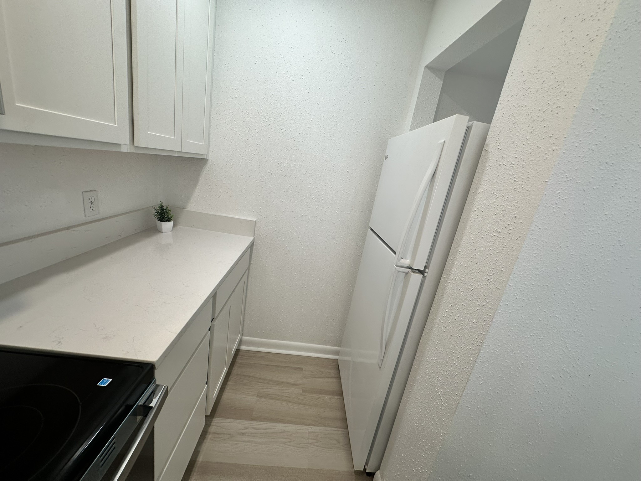 2800 Jeanetta Street, Unit 203 Houston, TX 77063 - Photo 13 of 34 a utility room with cabinets washer and dryer
