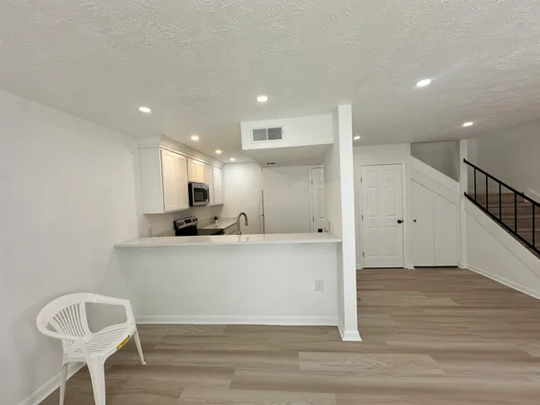 a view of kitchen with wooden floor