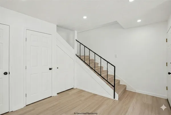 a view of an entryway with wooden floor