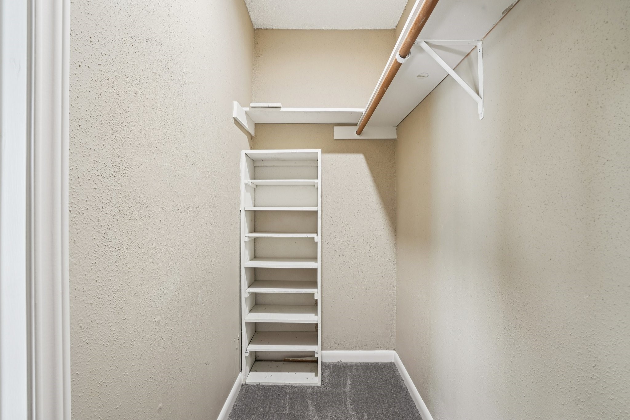 2800 Jeanetta Street, Unit 203 Houston, TX 77063 - Photo 25 of 34 a view of walk in closet with empty racks