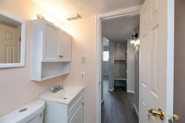a view of a bathroom from the hallway