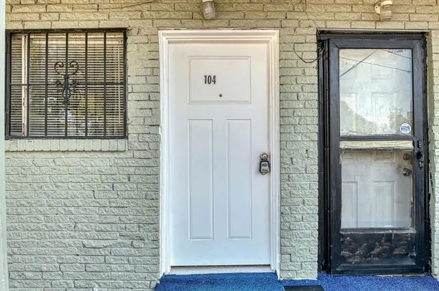 a view of a wooden door with a glass door
