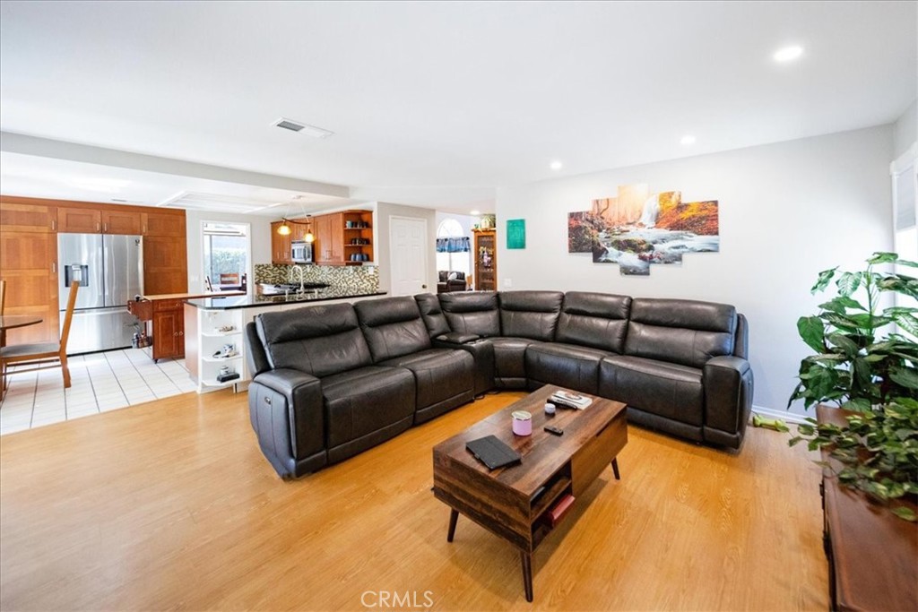 5963 Rio Valle Drive Bonsall, CA 92003 - Photo 12 of 49 a living room with furniture and a flat screen tv
