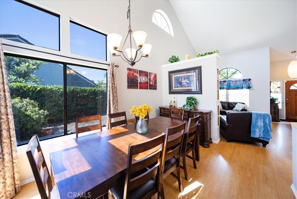 5963 Rio Valle Drive Bonsall, CA 92003 - Photo 13 of 49 a view of a dining room with furniture window and wooden floor