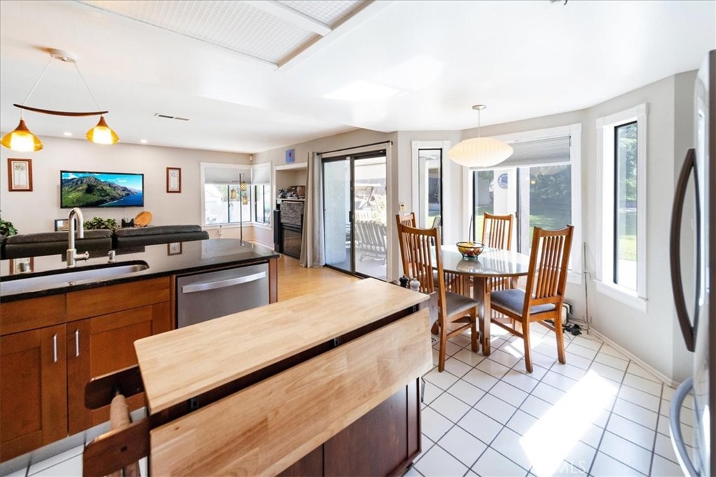 5963 Rio Valle Drive Bonsall, CA 92003 - Photo 15 of 49 a living room with furniture and a flat screen tv