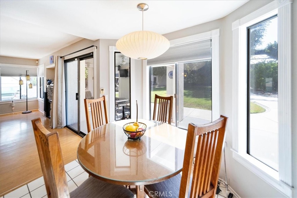 5963 Rio Valle Drive Bonsall, CA 92003 - Photo 19 of 49 a view of a dining room with furniture window and wooden floor