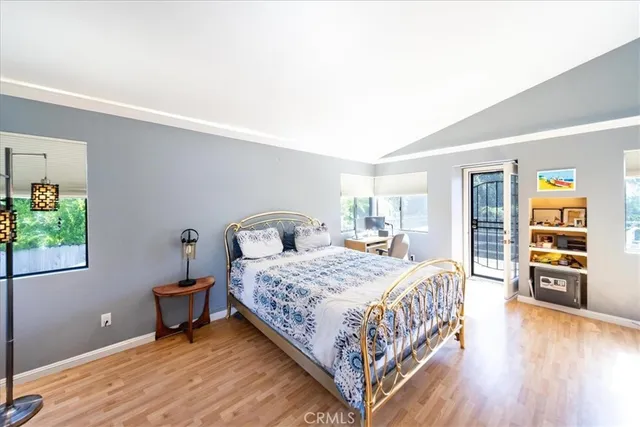 a bedroom with a bed and a table in it