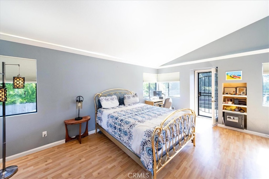 5963 Rio Valle Drive Bonsall, CA 92003 - Photo 22 of 49 a bedroom with a bed and a table in it