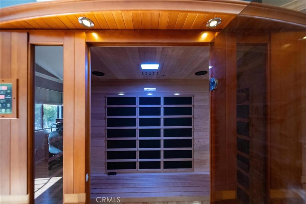 5963 Rio Valle Drive Bonsall, CA 92003 - Photo 23 of 49 a view of an empty room with wooden floor and windows