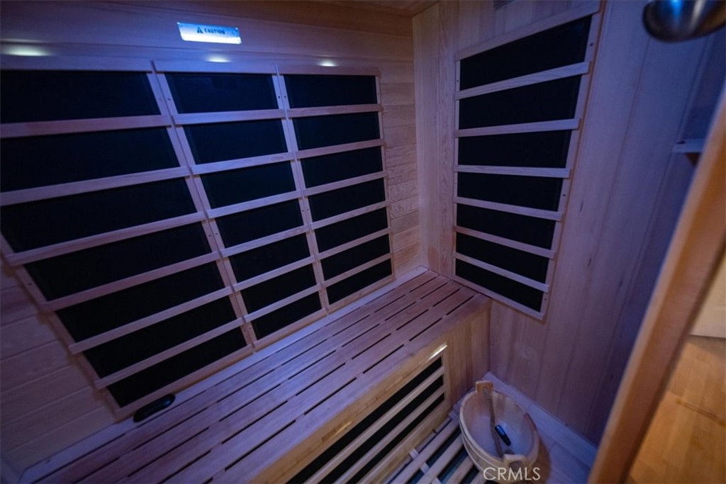 5963 Rio Valle Drive Bonsall, CA 92003 - Photo 24 of 49 a view of walk in closet and wooden floors