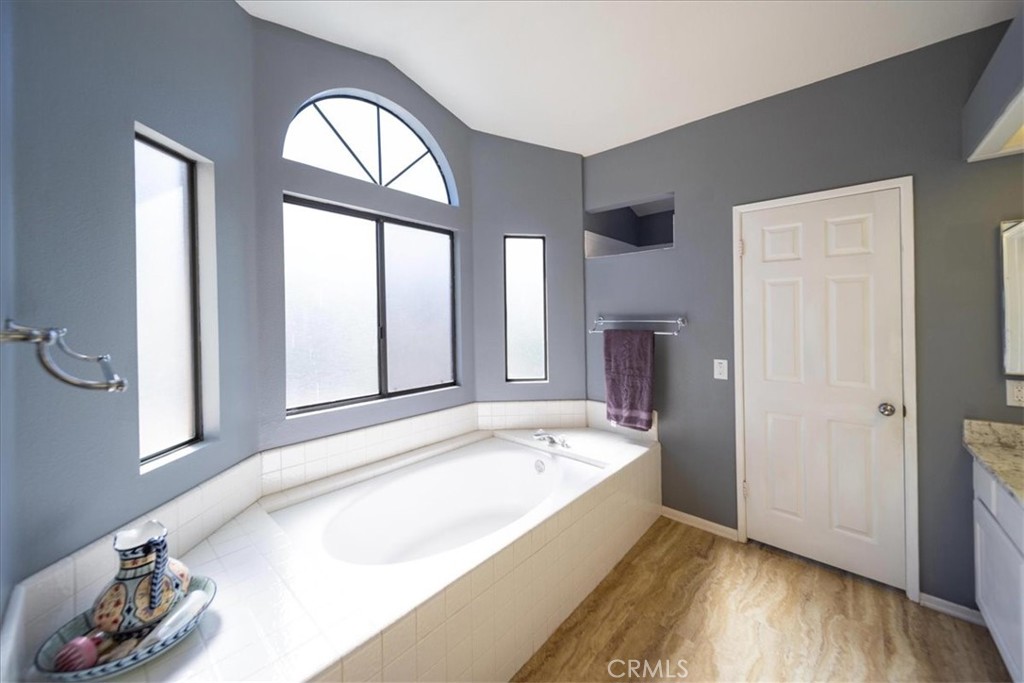 5963 Rio Valle Drive Bonsall, CA 92003 - Photo 26 of 49 a spacious bathroom with a tub and a window