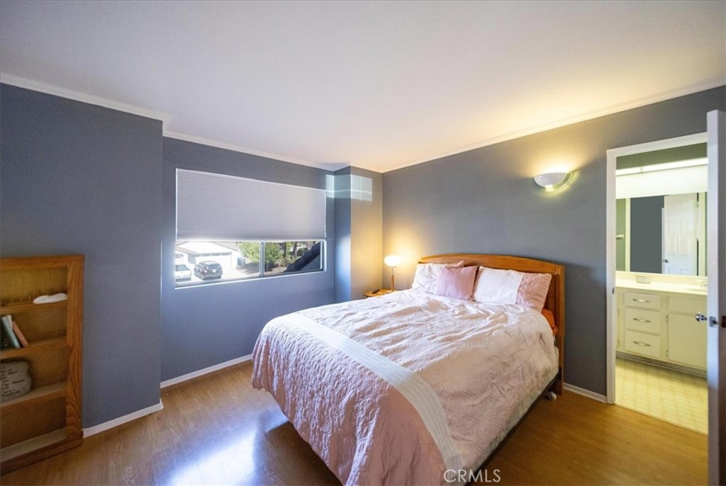 5963 Rio Valle Drive Bonsall, CA 92003 - Photo 27 of 49 a bedroom with a bed and a dresser