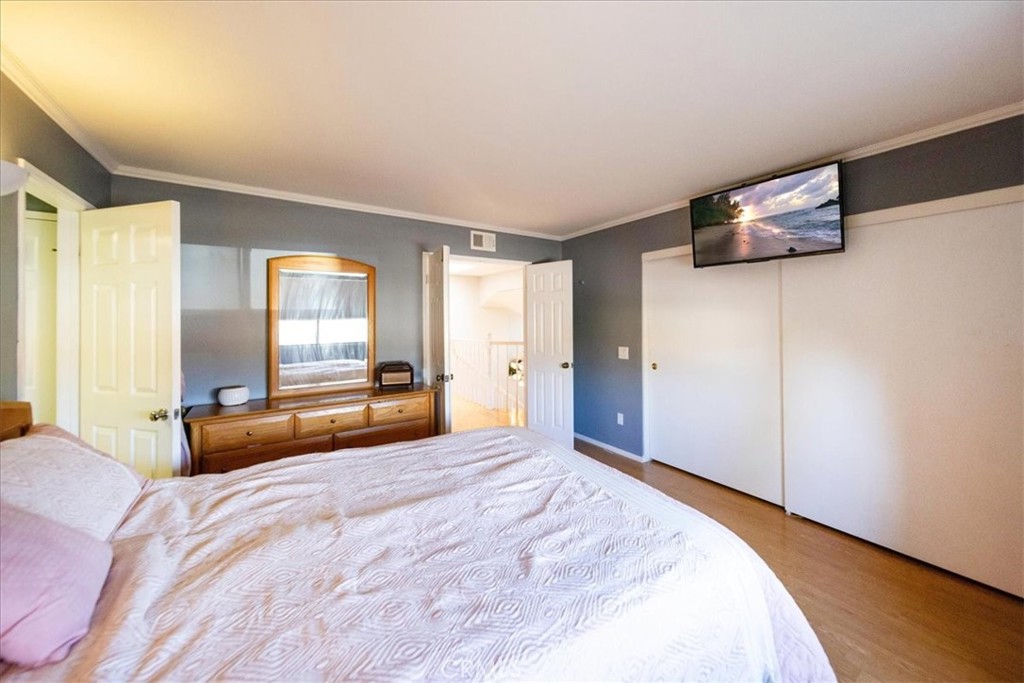 5963 Rio Valle Drive Bonsall, CA 92003 - Photo 28 of 49 a bedroom with a bed and a large window