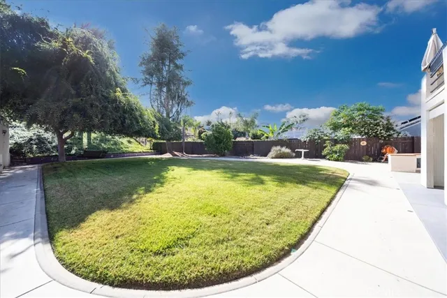 a view of a swimming pool with a yard