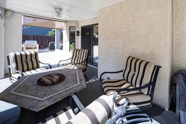 a view of a dining room with furniture and a chandelier
