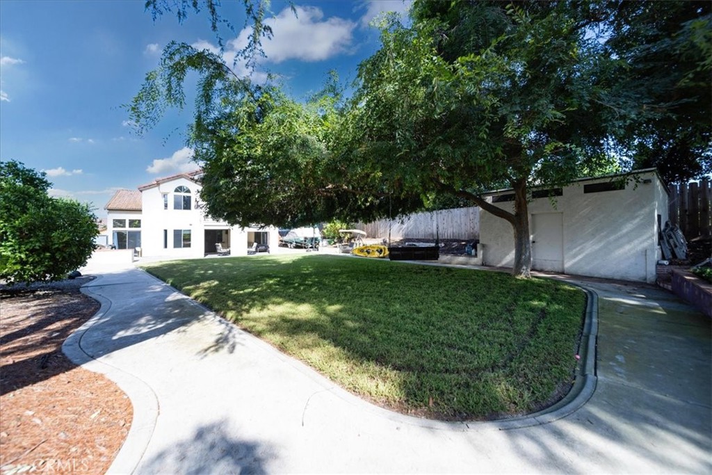 5963 Rio Valle Drive Bonsall, CA 92003 - Photo 42 of 49 a front view of a house with a garden