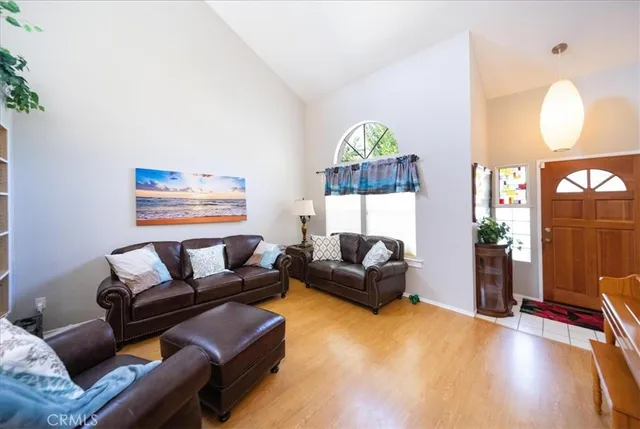 a living room with furniture and a lamp
