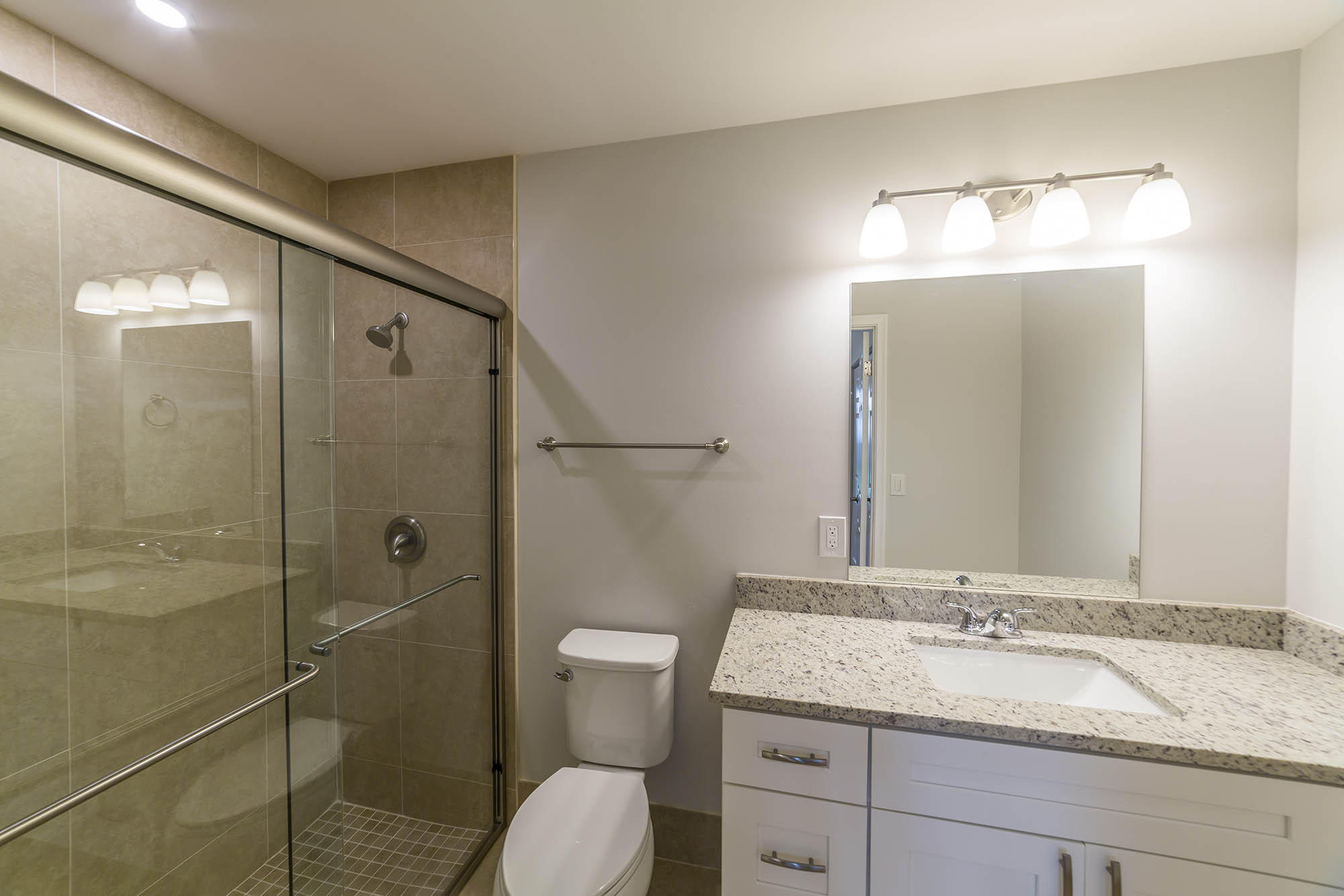 6337 Lasalle Road Delray Beach, FL 33484 - Photo 3 of 15 a bathroom with a granite countertop sink toilet and shower