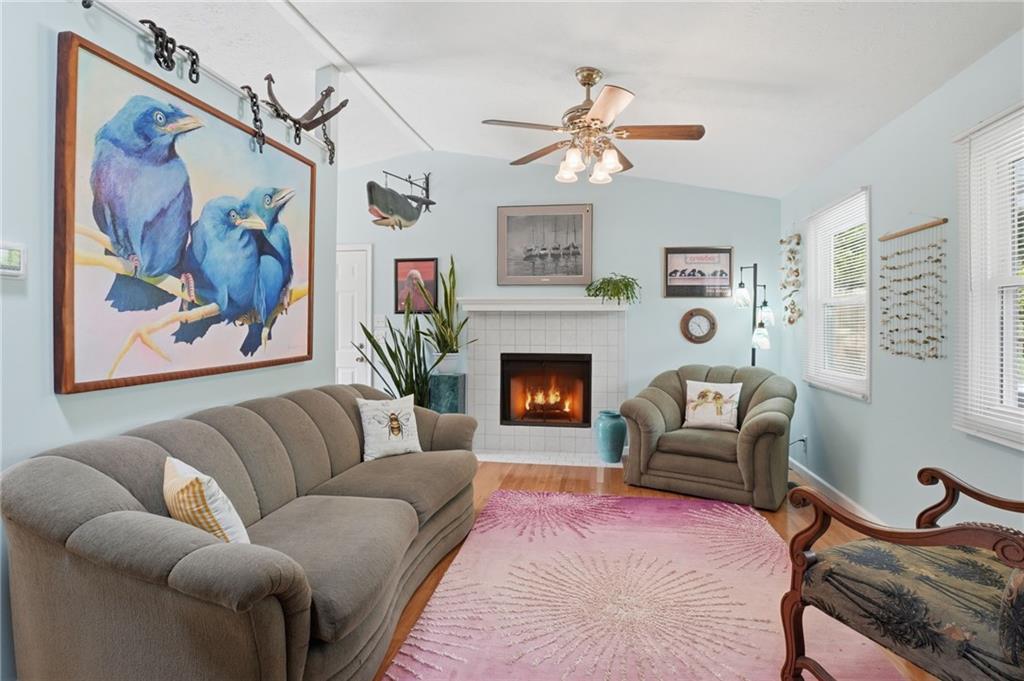 338 Arbour Way Suwanee, GA 30024 - Photo 5 of 32 a living room with furniture and a fireplace