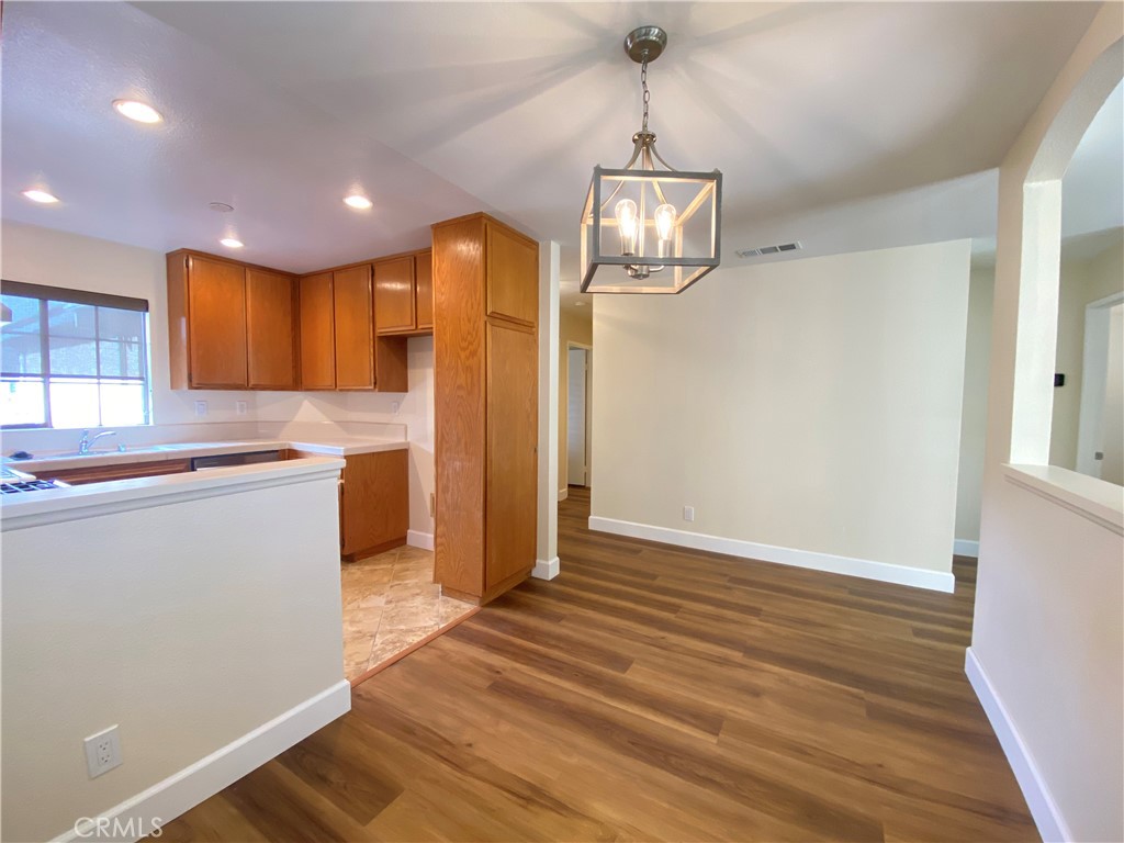 1084 North Jacaranda Road Colton, CA 92324 - Photo 3 of 19 a kitchen with stainless steel appliances granite countertop a refrigerator and a stove top oven