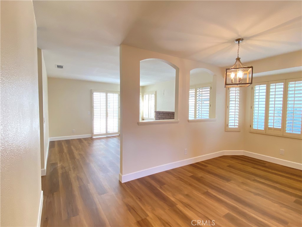 1084 North Jacaranda Road Colton, CA 92324 - Photo 6 of 19 a view of empty room with wooden floor and fan