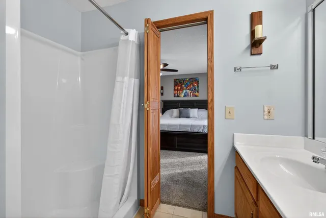 a en suite bathroom with a sink and a tub