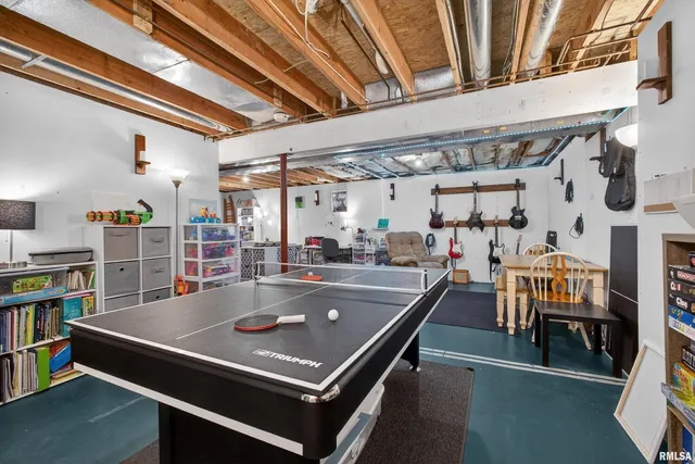 a water heater room with wooden floor
