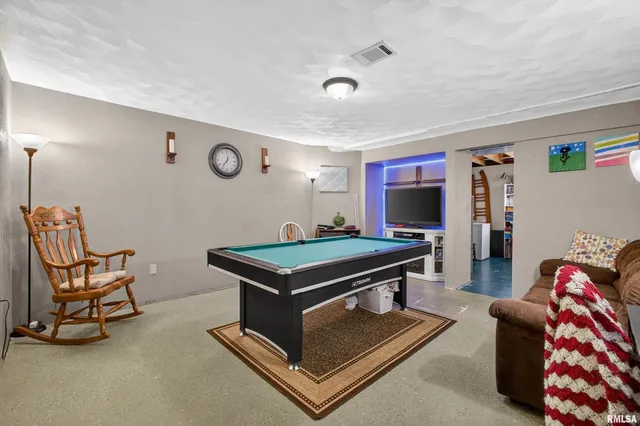 a room with furniture and a flat screen tv