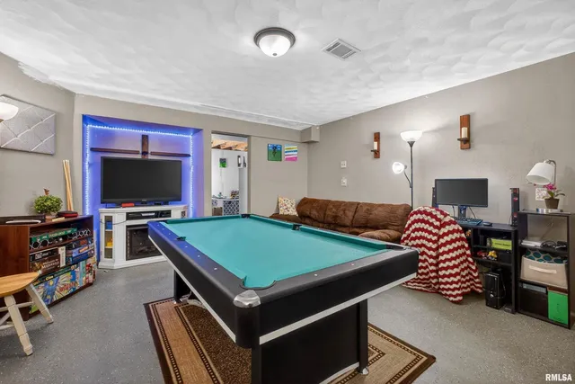 a room with furniture and a flat screen tv