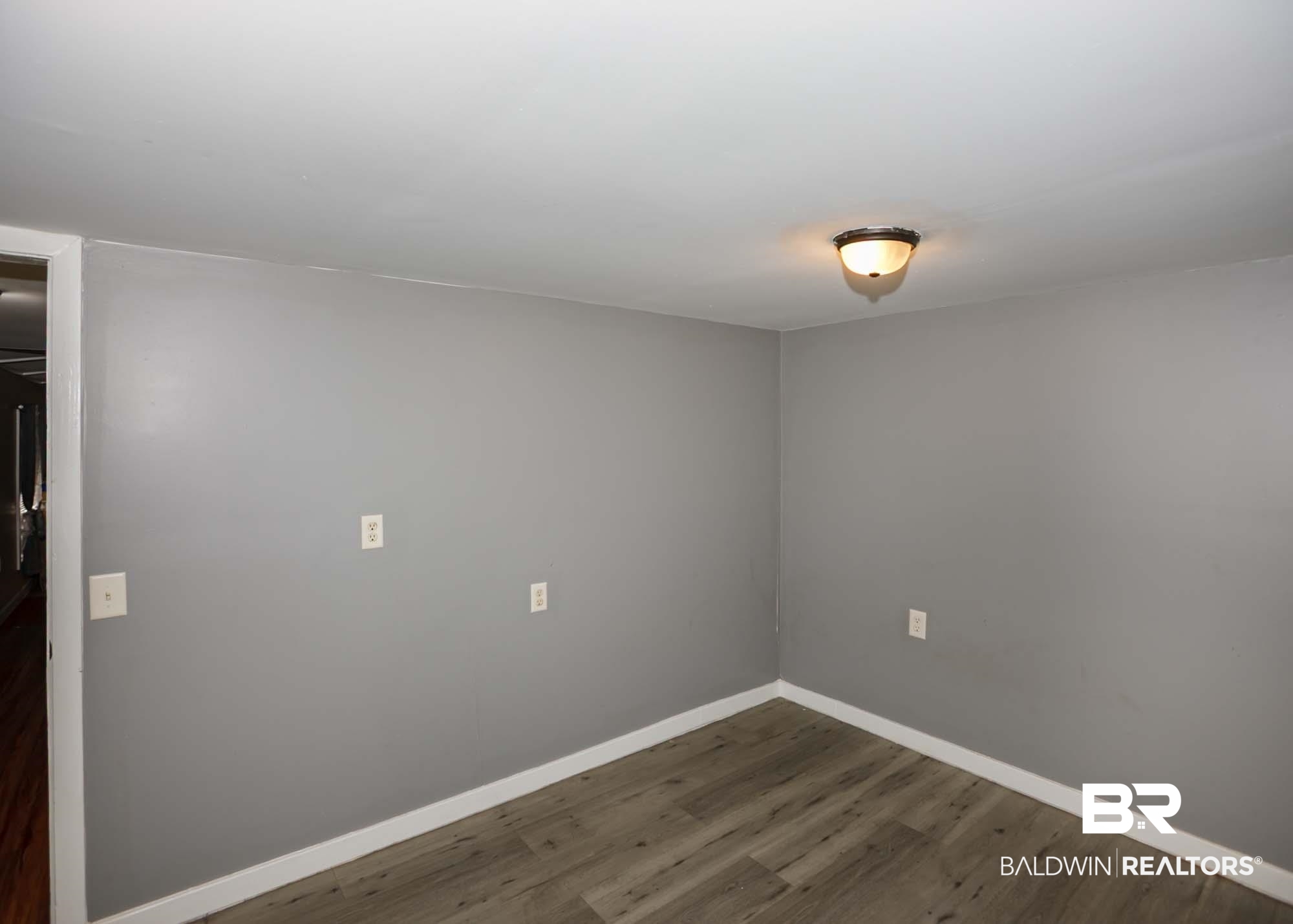 11998 Workman Avenue Foley, AL 36535 - Photo 53 of 59 Unfurnished room featuring dark wood-type flooring