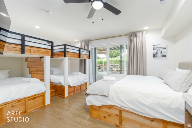 1188 South Old Trappers Loop Road Huntsville, UT 84317 - Photo 55 of 92 Spacious room featuring multiple built-in bunk beds with integrated storage, a large bed with under-bed storage, wood-finish flooring, a ceiling fan, and recessed lighting