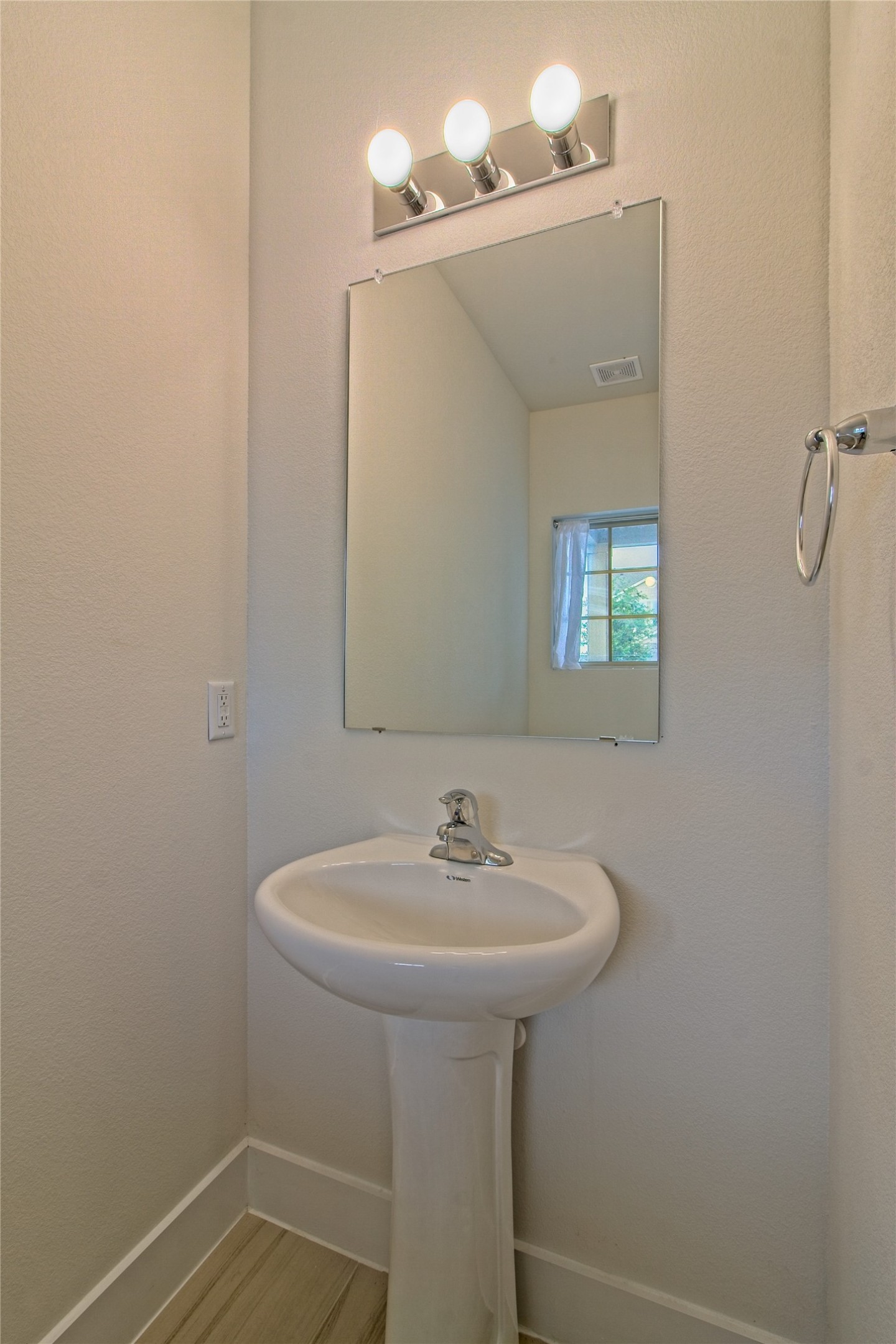 555 White Steppe Way Georgetown, TX 78626 - Photo 19 of 40 a bathroom with a sink a mirror and a window