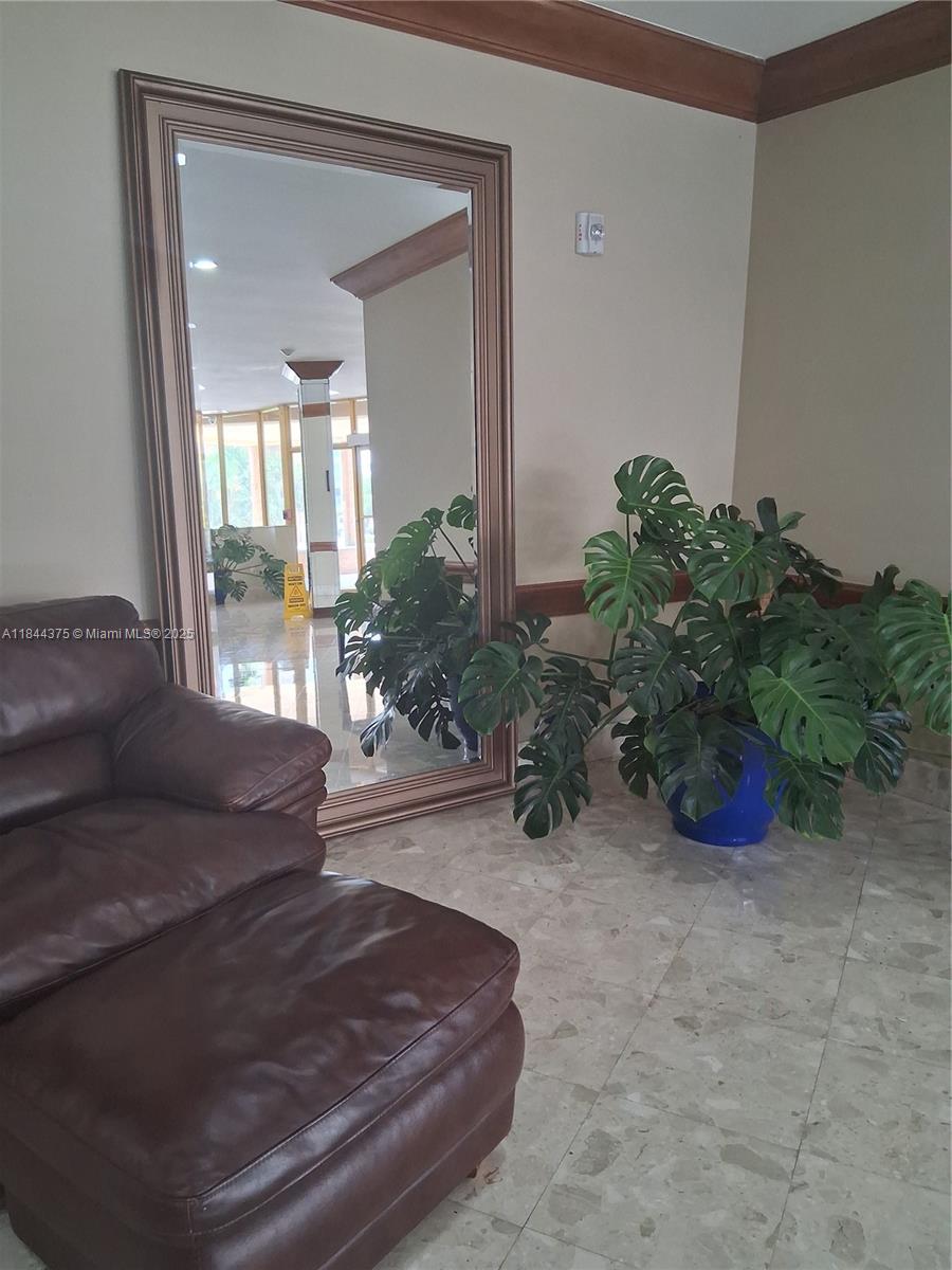 100 Golden Isles Drive, Unit 206 Hallandale Beach, FL 33009 - Photo 16 of 22 a living room with furniture