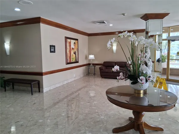 a view of a livingroom with furniture and a table