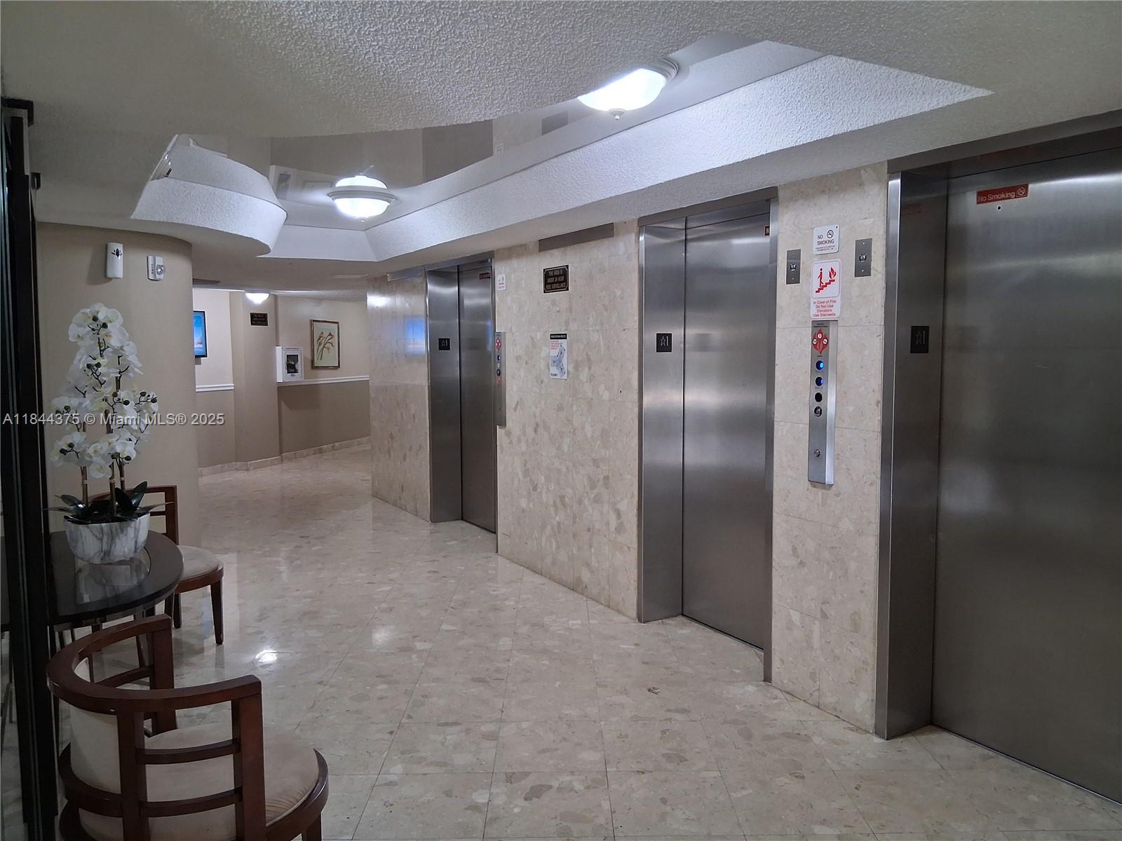 100 Golden Isles Drive, Unit 206 Hallandale Beach, FL 33009 - Photo 7 of 22 a view of hallway with livingroom and stairs