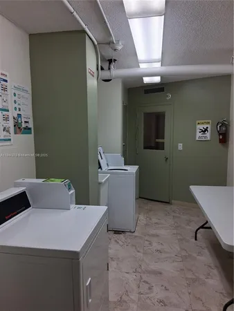 a bedroom with a sink and a mirror