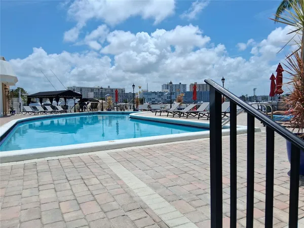 a view of swimming pool with seating space