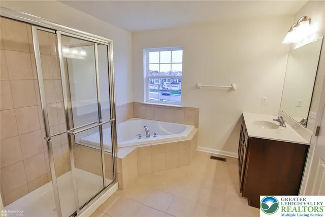 a bathroom with a sink and a shower