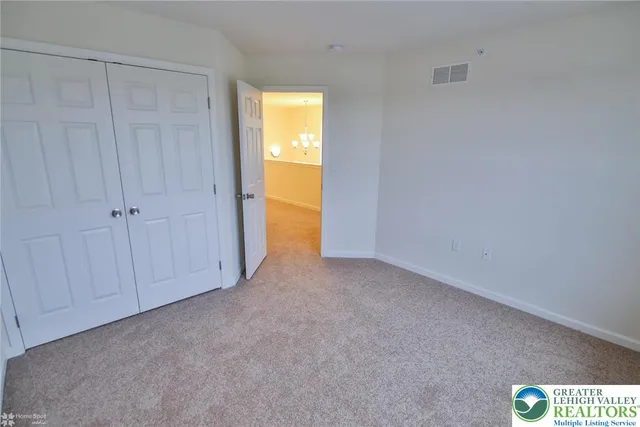 a view of an empty room and a window