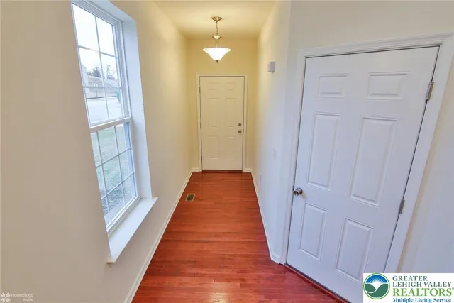 a view of a bathroom from the hallway