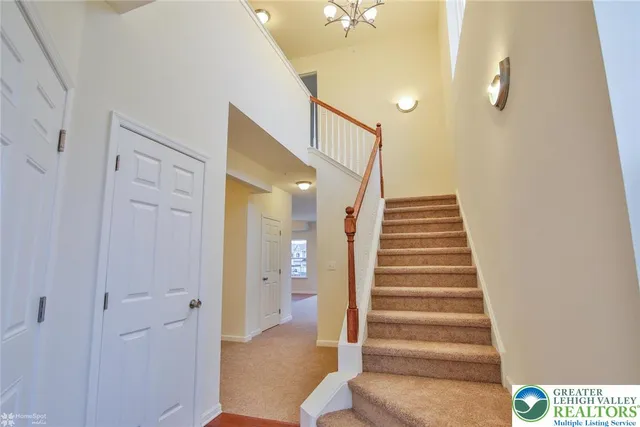 a view of entryway with furniture and wooden floor