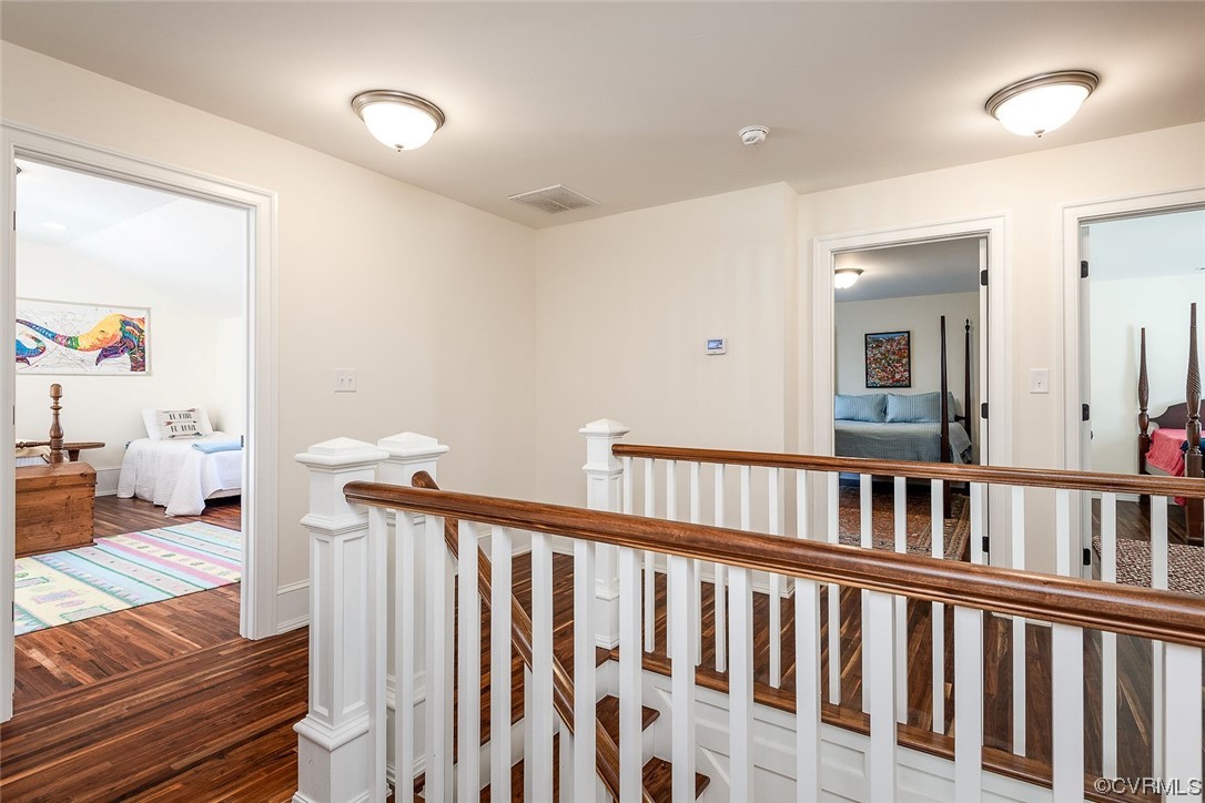 8401 Croaker Road Williamsburg, VA 23188 - Photo 36 of 48 a view of a hallway with wooden floor and stairs
