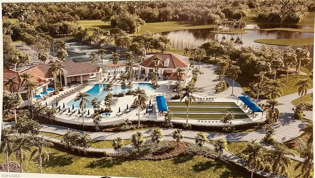 an aerial view of residential houses with outdoor space and trees