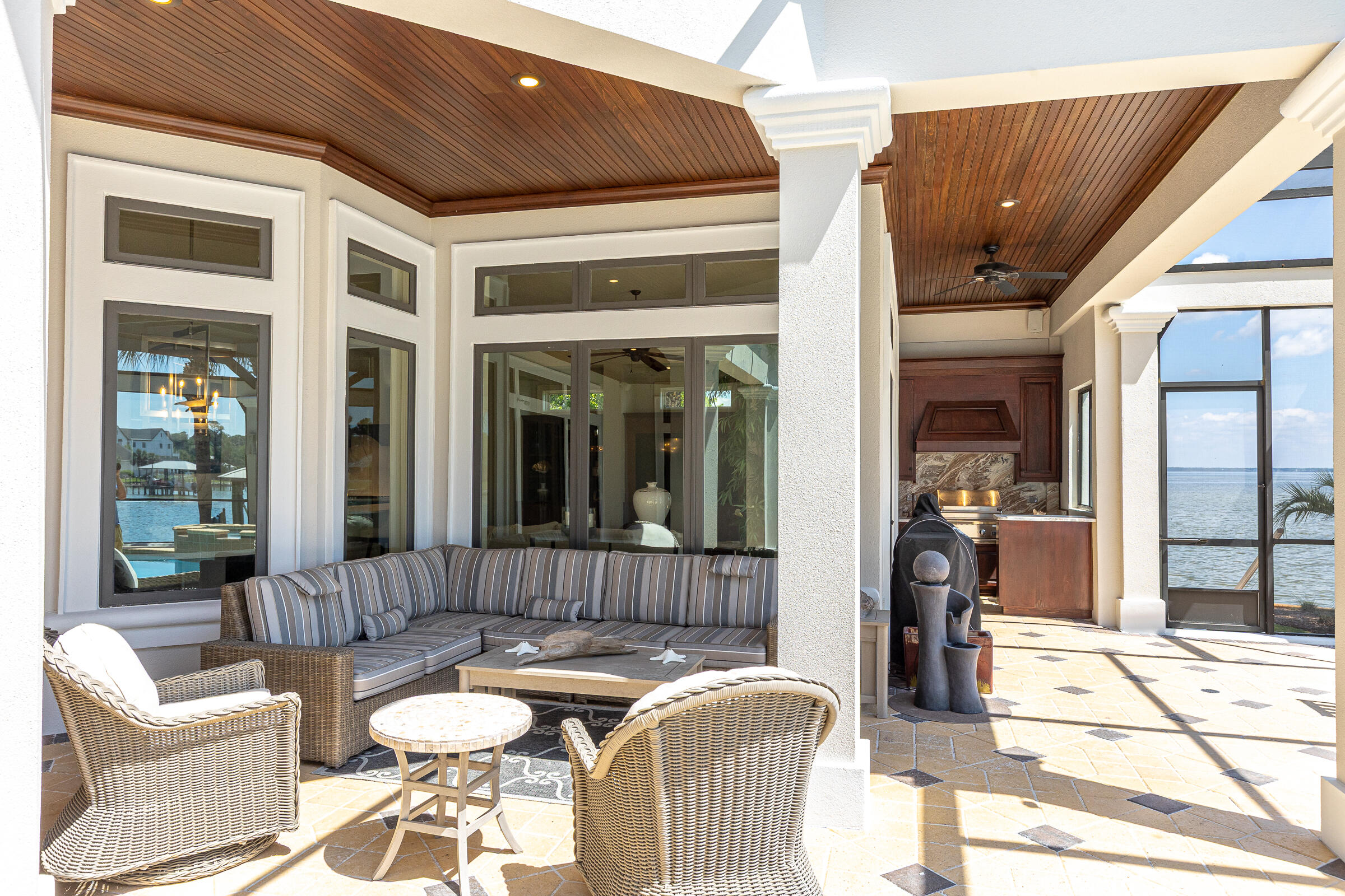 1806 Driftwood Point Road Santa Rosa Beach, FL 32459 - Photo 27 of 142 a outdoor space with patio the couches and a dining table with the view of the house